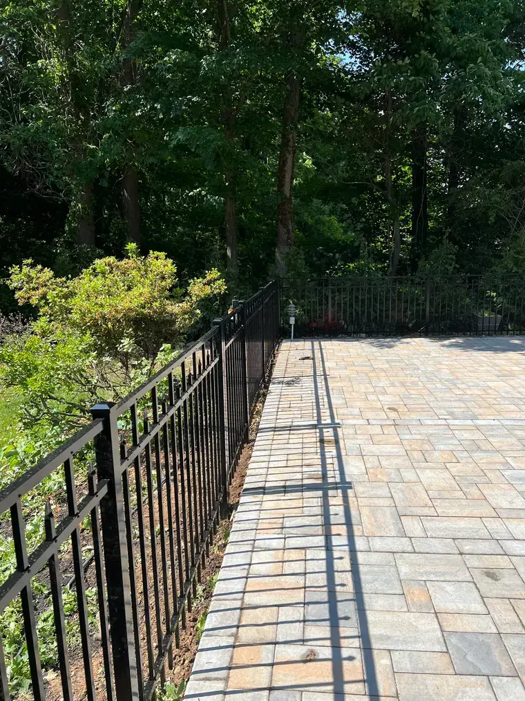 Ornamental Fence Along a Paver Walk