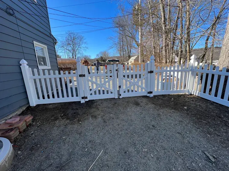 Picket Fence Beside a Drive