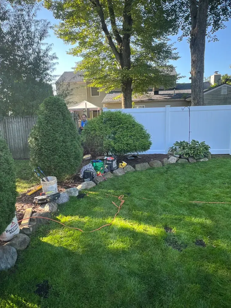 Vinyl Privacy Fence Behind a Planted Border