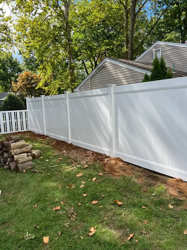 Vinyl Privacy Fence Against a Treeline
