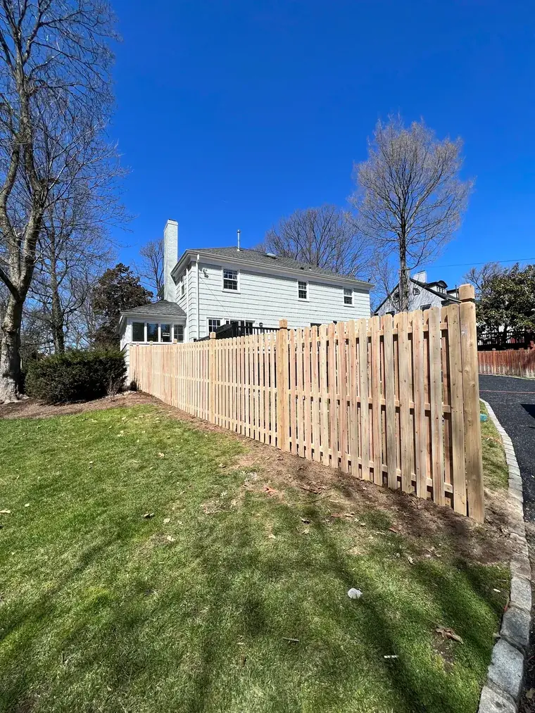 Cedar Fence Stepping Down a Slope